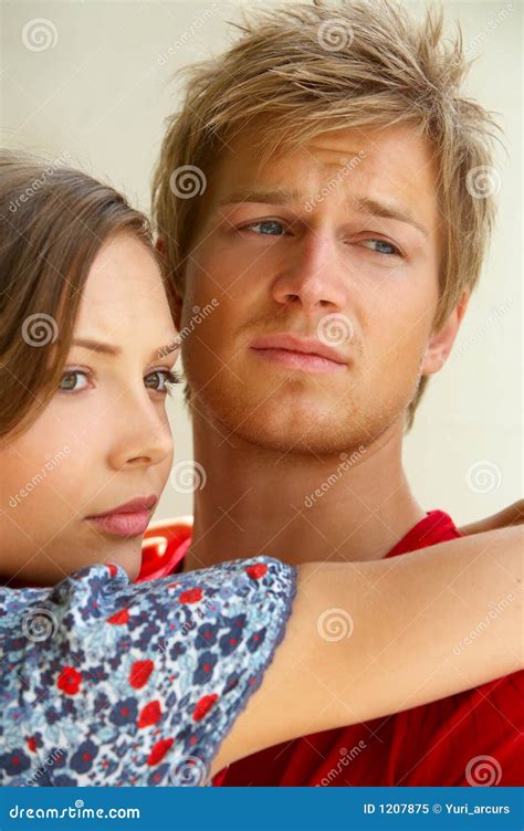 Fashion Shot Of A Young Man Comforting His Girlfriend Stock Image