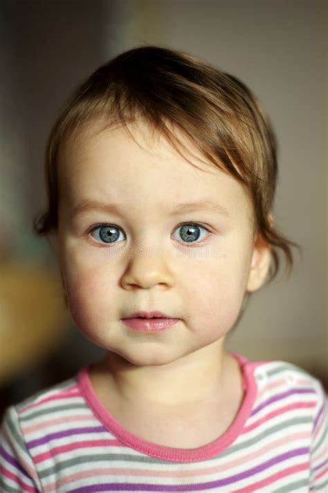 Portrait Of White Baby Girl With Grey Eyes Concept Of Calmness Care