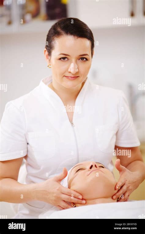 Facial Treatment With Massage Therapist During Seance At Beauty Spa