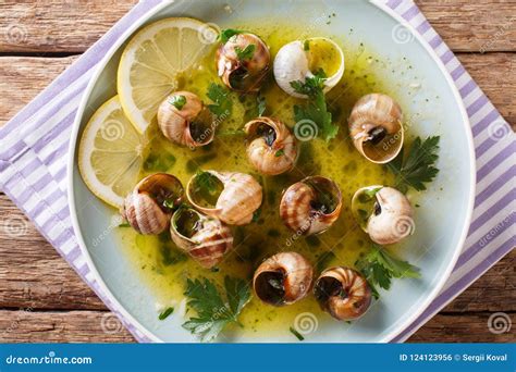 Spicy French Snails Escargot Cooked With Butter Parsley Lemon Stock