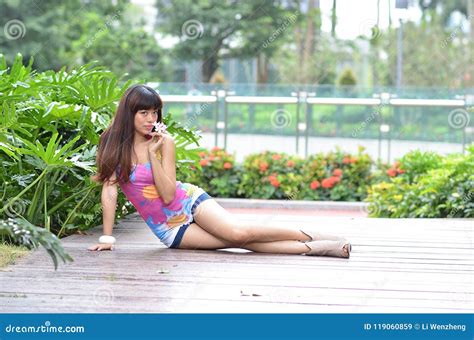 beautiful asian girl shows her youth in the park stock image image of heels legs 119060859