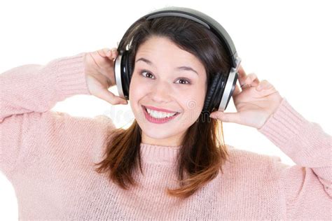 Beautiful Young Woman Listening To Music In Headphones On White
