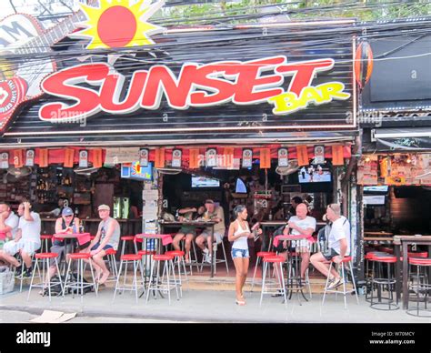 Phuket Thailand February 2nd 2012 Men And Girls In The Sunset Bar