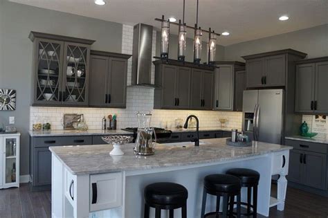 Mixing and matching your cabinetry in deep charcoal gray and white. River White Granite Countertops (Pictures, Cost, Pros & Cons)