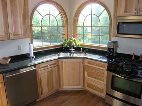 Install task lighting underneath upper cabinets above a corner sink. Corner Kitchen Sink | hac0.com