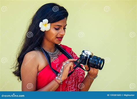 Female India Photographer Photographing With Digital Camera On The