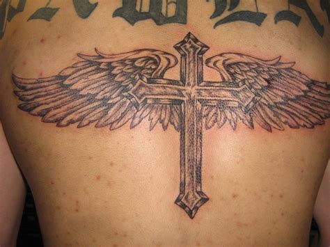 Among all wing tattoos, angel wing tattoos are the most popular ones. Angel Wings Cross Tattoo On Back » Tattoo Ideas
