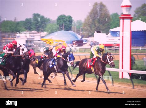 Jockeys Racing Their Horses On Track Stock Photo Alamy