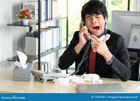 Man In The Office Pick Up A Phone And Coughing And Sneezing During Talk