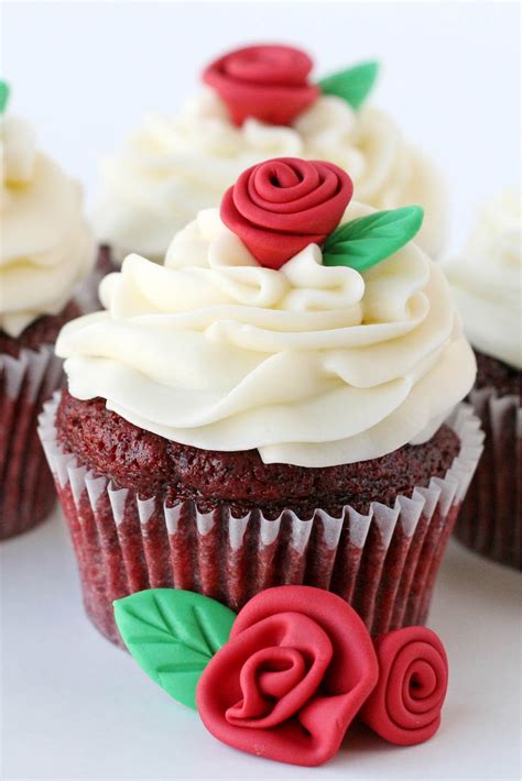 To make the ribbon stripes across the top of the cupcake, roll out a small amount of fondant and cut strips in the thickness you want the ribbons. How to make Fondant Roses and Leaves - Glorious Treats
