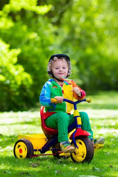 Little Boy On Colorful Tricycle — Stock Photo © Famveldman 114351254