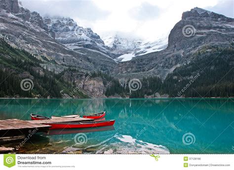 Red Canoes At Lake O Hara Yoho National Park Canada Stock Photo