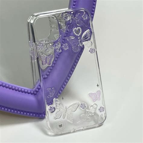 The Case Is Made Out Of Clear Plastic And Has Butterflies On It As