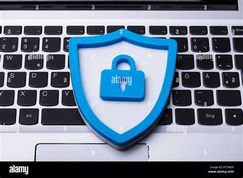 Blue Security Icon On Laptop Keypad Stock Photo Alamy