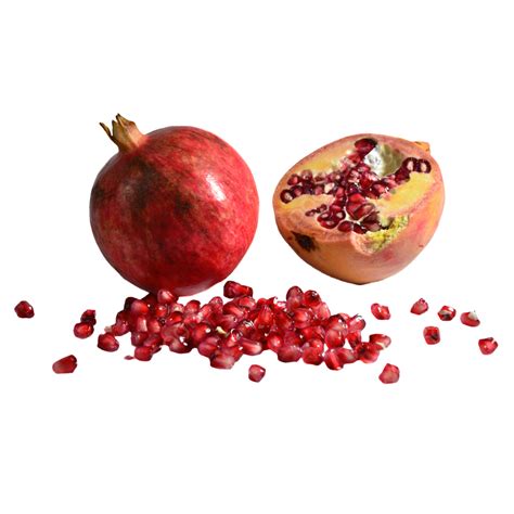 Two Cut Pomegranates And A Pile Of Red Pomegranate Seeds Pomegranate
