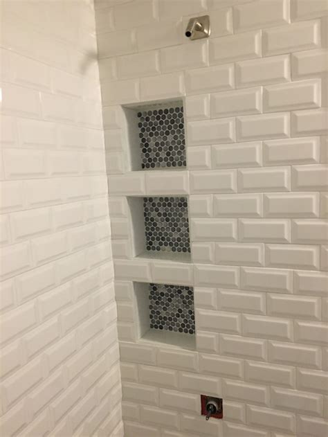 3 pro installation secrets daltile subway tile installed on a tub platform layout lines. Beveled subway tile with penny tile accent in the niche ...