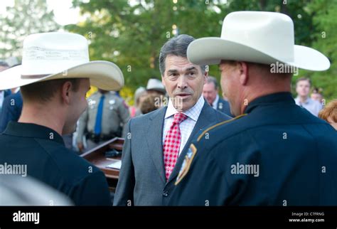 Texas Gov Rick Perry With Uniformed State Troopers In Austin During