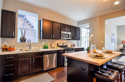 Maybe you would like to learn more about one of these? Remodeled kitchen- espresso cabinets and marble counter ...