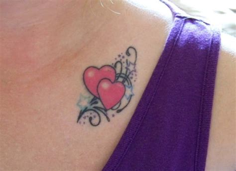 44 small heart tattoo in between breast