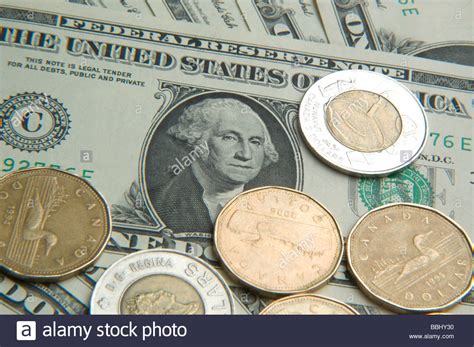 Also compare live money transfer rates. American dollar bill surrounded by Canadian one and two dollar coins Stock Photo: 24366020 - Alamy