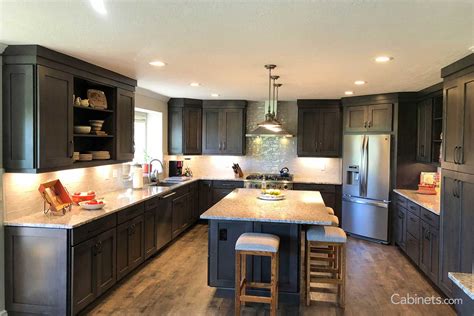 With an open floor plan, the kitchen functions as the center of unwinding and entertaining family. Pin by the lunch lady on best designs | Slate kitchen, Maple kitchen cabinets, Rustic kitchen