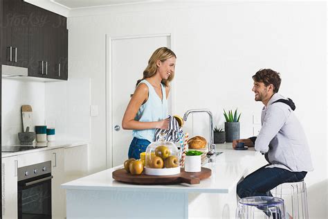 Young Attractive Couple In The Kitchen By Image Supply Co Couple