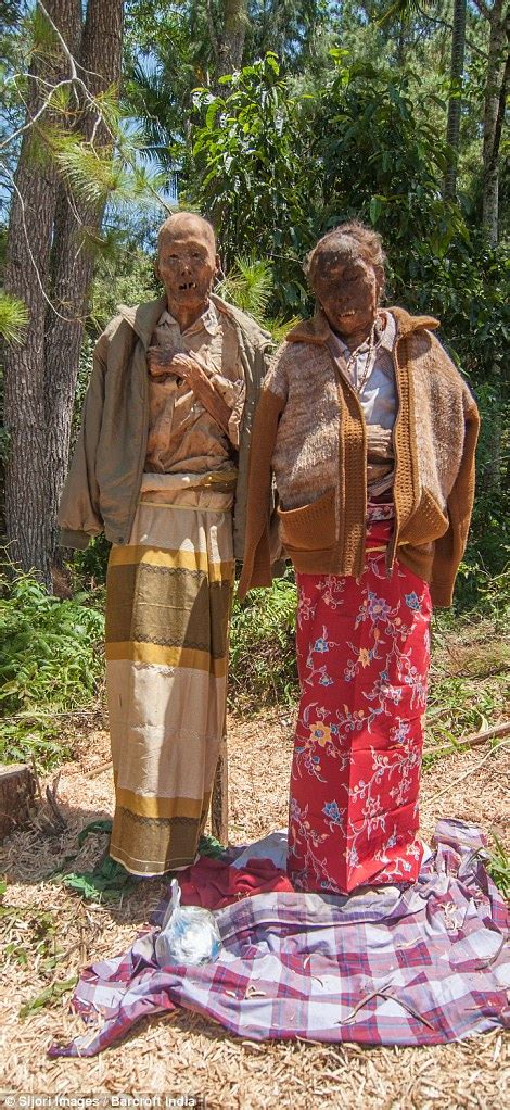 Indonesian Village Toraja Dig Up Dead Relatives And Give Them New Clothes In Ritual Daily Mail