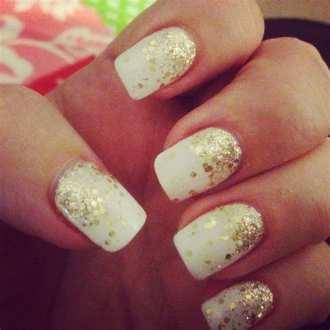my christmas nails white polish with gold glitter and gold droplets