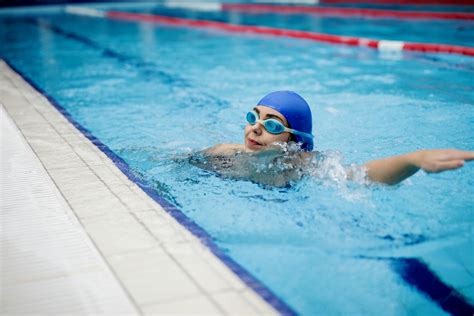 Person In Swimming Goggles In Swimming Pool · Free Stock Photo