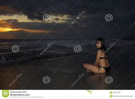 Young Beautiful And Asian Woman In Black Bikini Posing Relaxed Having