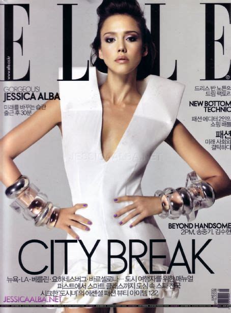 A Woman In White Dress On The Cover Of A Magazine With Her Hands On Her
