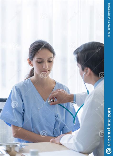 a doctor take care of sick patient woman at the hospital or medical clinic stock image image