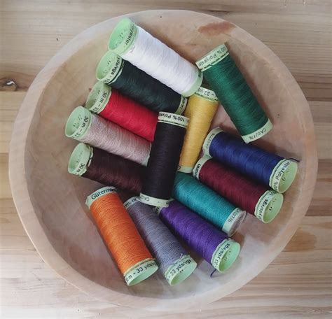 Polyester Thread - strong and has a silk-like gloss. 30 meter bobbin.