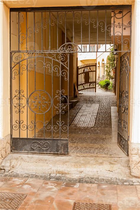 An Old Gate With A Corridor Leading To The Courtyard Of The House