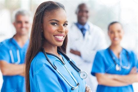 African Female Nurse With Colleagues Stock Photo By ©michaeljung 34179957