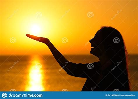 Woman Profile Holding Sun At Sunrise On The Beach Stock Photo Image
