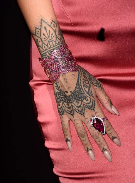 Rihanna's tattoos are just one way the. Her henna-style tatt on her hand. - A Guide To Rihanna's ...
