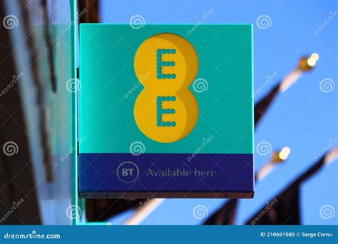 Ee And Bt Logos On A Sign Outside A Mobile Phone Shop Editorial Stock