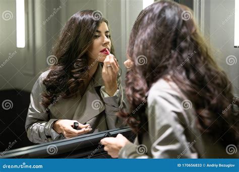 Model Painting Her Lips In Front Of Mirror Indoors Stock Image Image Of Adult Lipstick 170656833