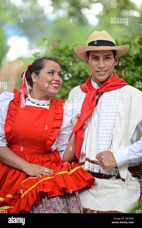 A Couple Wearing Traditional Attire From The Colombian Region Of