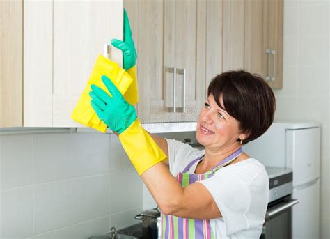 Mature Woman Cleaning Stock Image Image Of Polishing 261812831