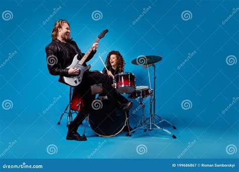 Full Length Photo Two Funky Popular Rock Band Perform New Composition Man Play Guitar Woman Drum
