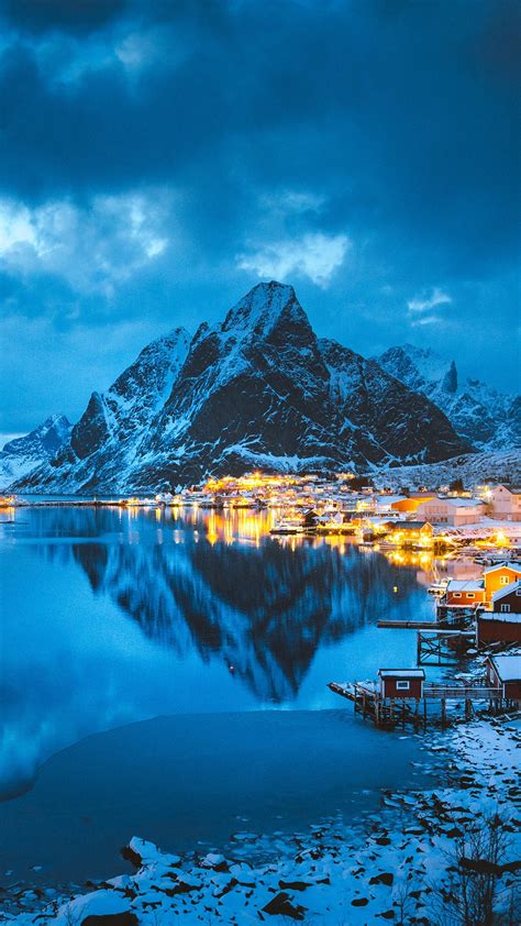 Reine Village With Olstinden Peak In Winter Evening Lofoten Islands