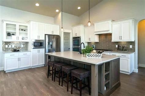 The new callahan door style: Image result for dark grey island white cabinets | Galley kitchen design, Cottage kitchen ...