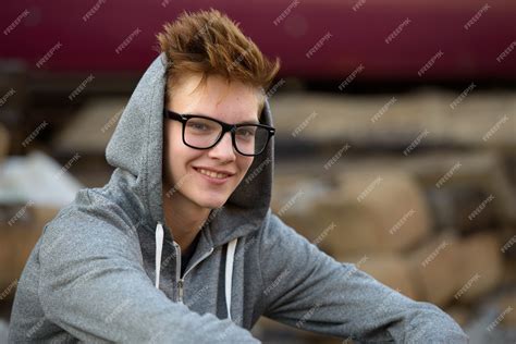 Premium Photo Portrait Of Young Handsome Teenage Boy At The Railway