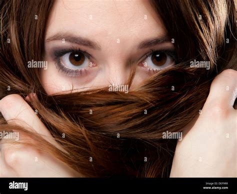 Close Up Portrait Of A Beautiful Woman Covers The Face By Long Brown Hairs Stock Photo Alamy