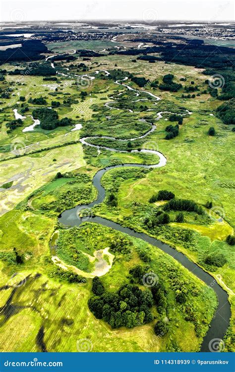 Top View Of The Valley Of A Meandering River Among Green Stock Image