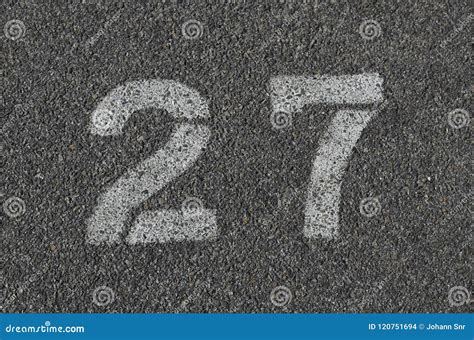 White 27 Painted On Tar Stock Photo Image Of Easy Count 120751694