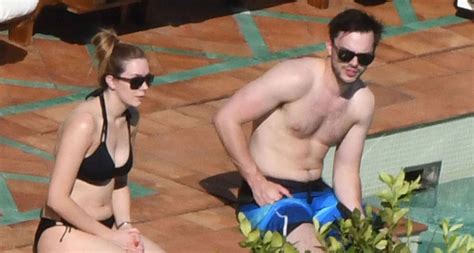 Nicholas Hoult Relaxes Shirtless By The Pool In Italy