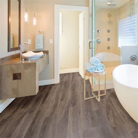 It is easy to maintain. Brown Natural oak effect Waterproof Luxury vinyl click ...